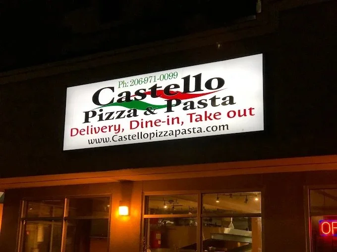 Exterior sign of Castello Pizza & Pasta on Rainier Ave South in Seattle, offering dine-in, takeout, and pizza delivery